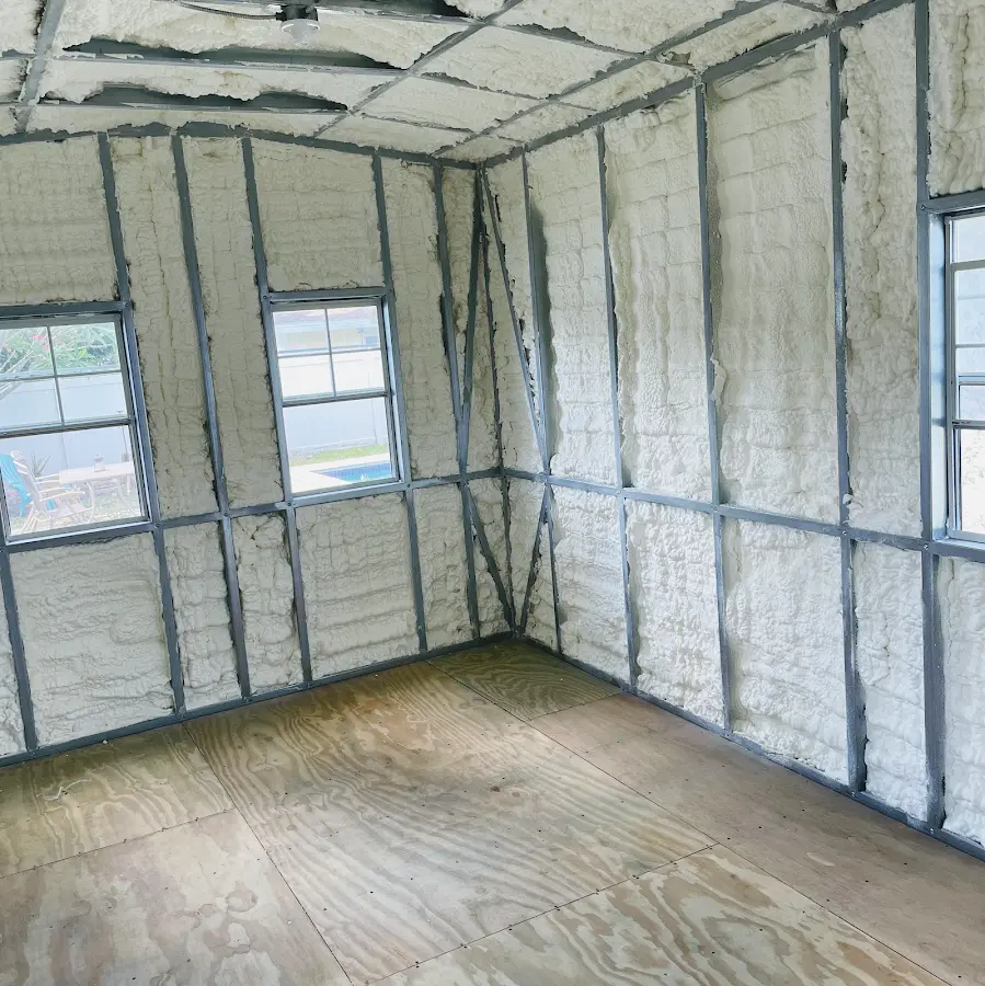 Closed-cell spray foam insulation applied to wall cavities in a residential project in Ulysses